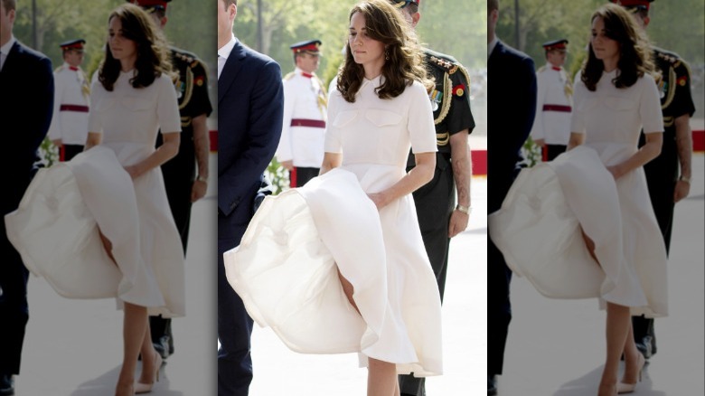 Princess Catherine trying to hold her dress down