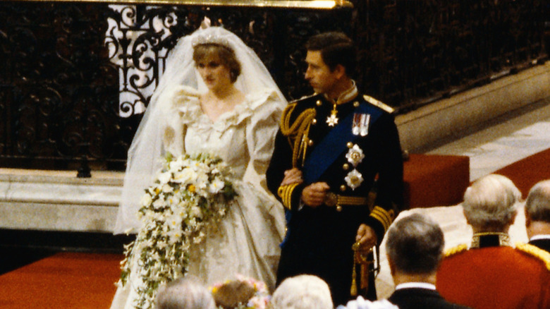 Princess Diana and Prince Charles walking down the aisle at their wedding