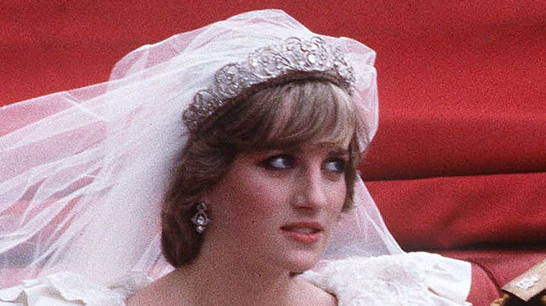 Princess Diana and Prince Charles riding in a carriage on their wedding day