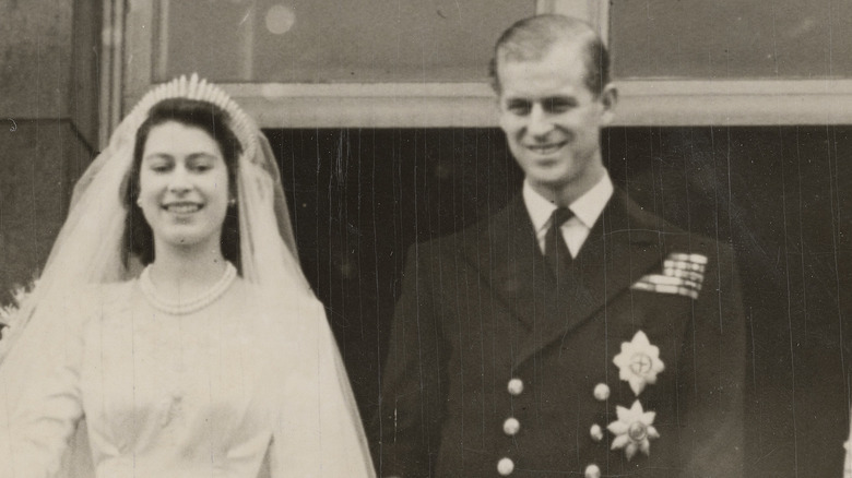 Queen Elizabeth II and Prince Philip (middle) on the balcony at Buckingham Palace after their wedding 