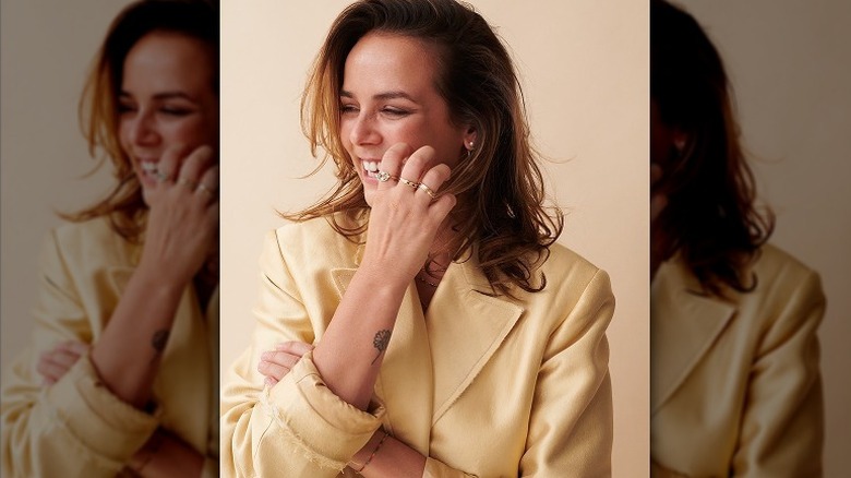 Pauline Ducruet wearing yellow laughing