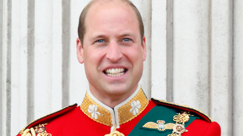 Prince William smiling on the Buckingham Palace balcony