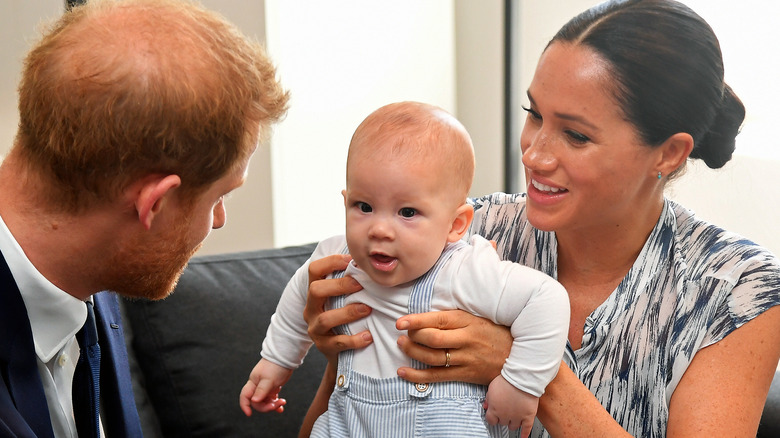 Prince Harry and Meghan Markle holding Archie