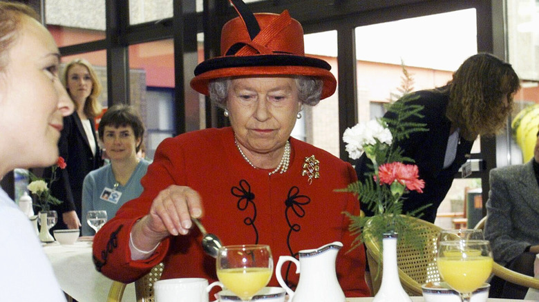 Queen Elizabeth II eating