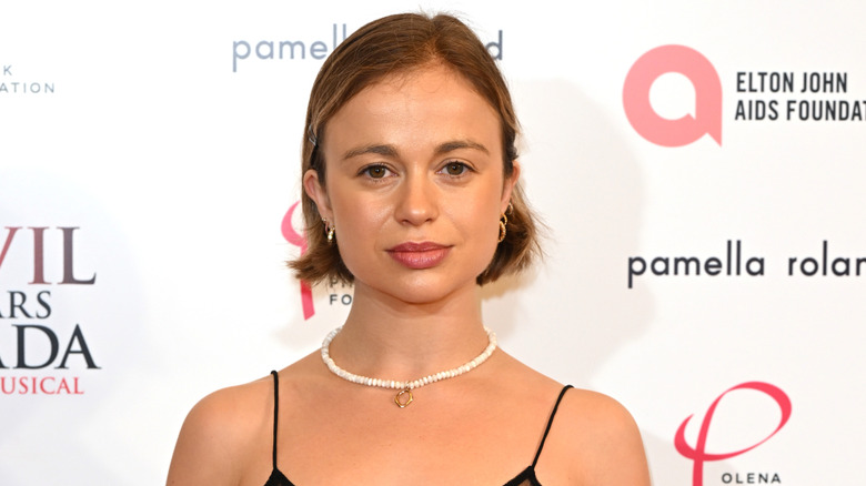 Closeup of Lady Amelia Windsor posing with a short bob haircut at event