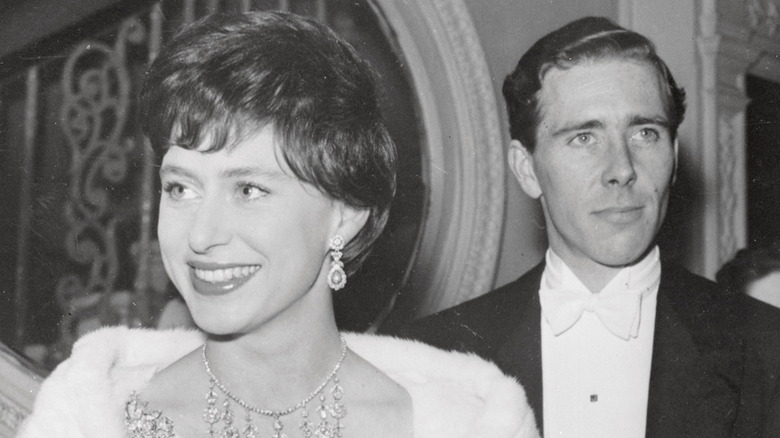 Young Princess Margaret smiling with a bob haircut alongside Antony Armstrong-Jones