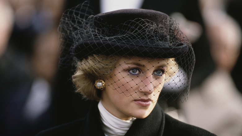 Princess Diana wearing black hat and veil