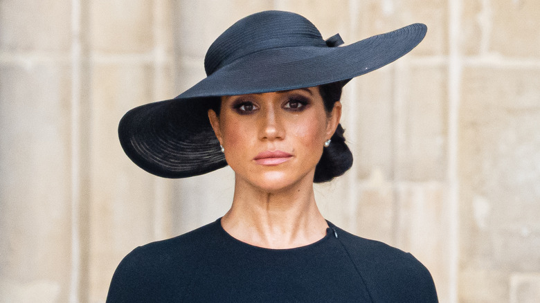 Meghan Markle straight-faced