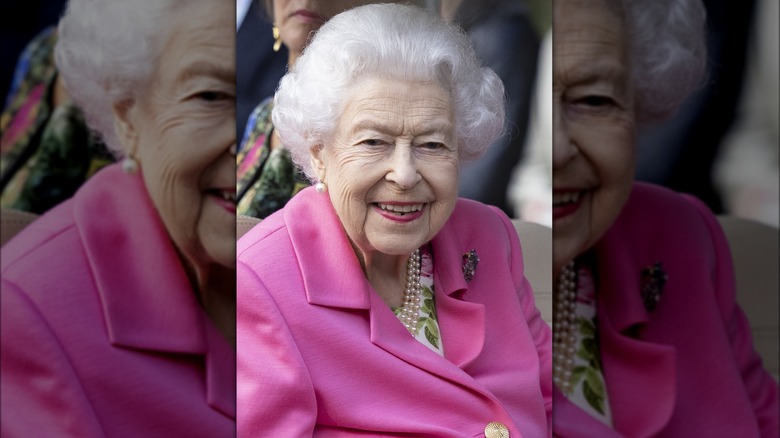 Queen Elizabeth II in pink lemonade coat at flower show 2022