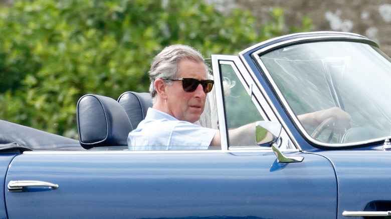 King Charles III driving