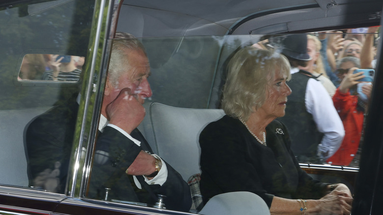 King Charles III crying in car