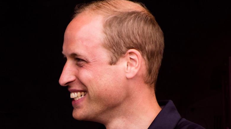 Side profile of Prince William smiling