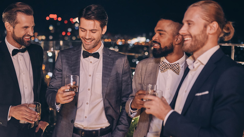 Group of men smiling