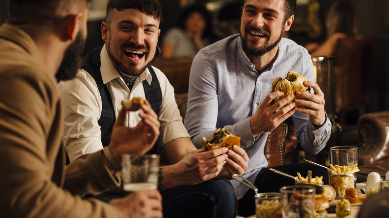 Men eating together