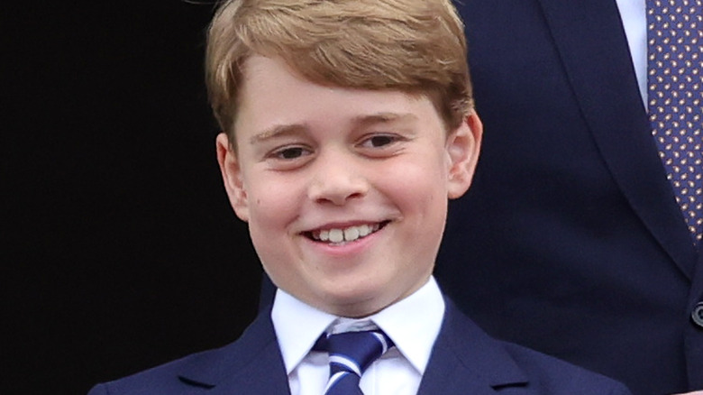 Prince George smiling at the camera