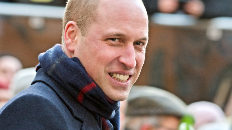 Prince William smiling at the camera