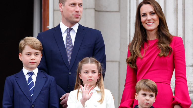 Prince William and Princess Catherine on the palace balcony with their children