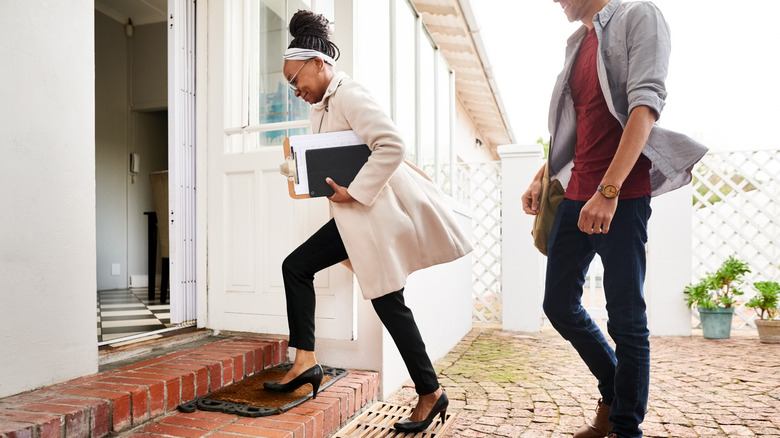 Real estate agent showing open house