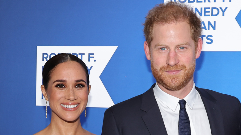 Meghan Markle smiling with Prince Harry