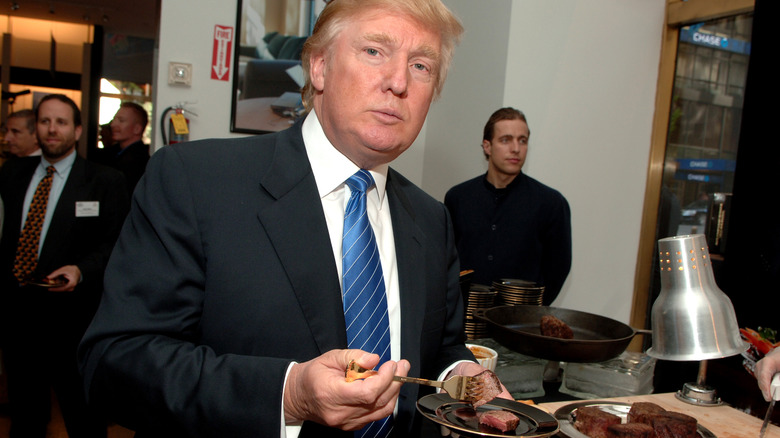 Donald Trump with plate of steak