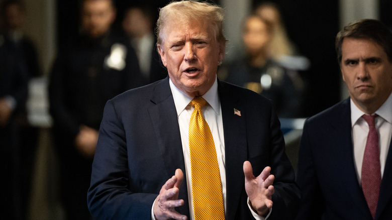 Donald Trump outside courthouse gold tie