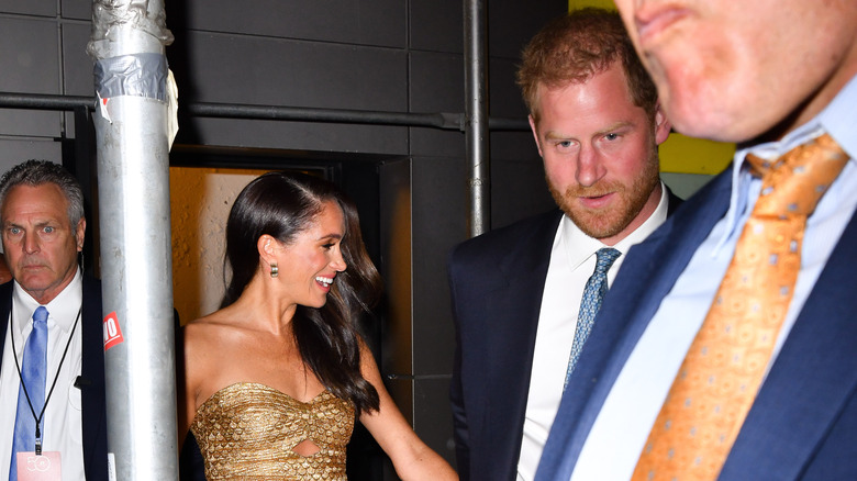 Harry and Meghan being caught by photographers