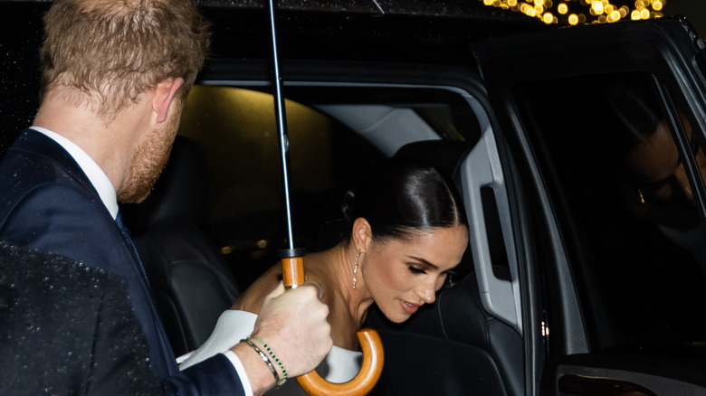 Meghan exiting car