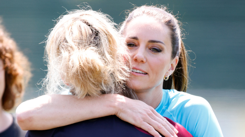 Kate Middleton hugging a woman