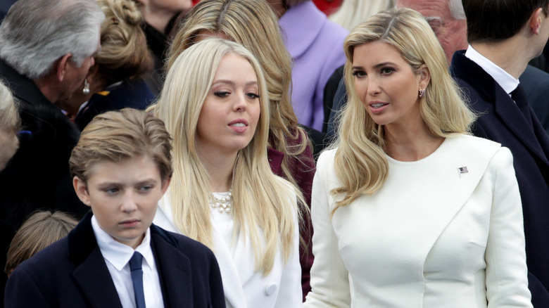 Barron Trump frowning with Tiffany and Ivanka Trump