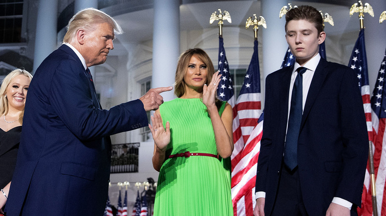 Donald Trump pointing at Barron outside White House