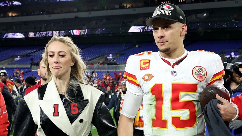 Patrick and Brittany Mahomes holding hands