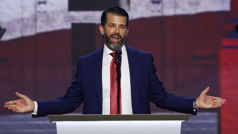 Donald Trump Jr. speaking into a microphone