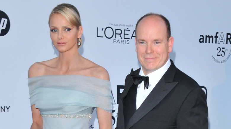 Princess Charlene and Prince Albert posing in evening wear