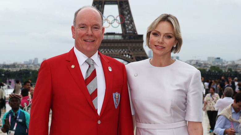 Prince Albert and Princess Charlene posing in front of the Eiffel Tower