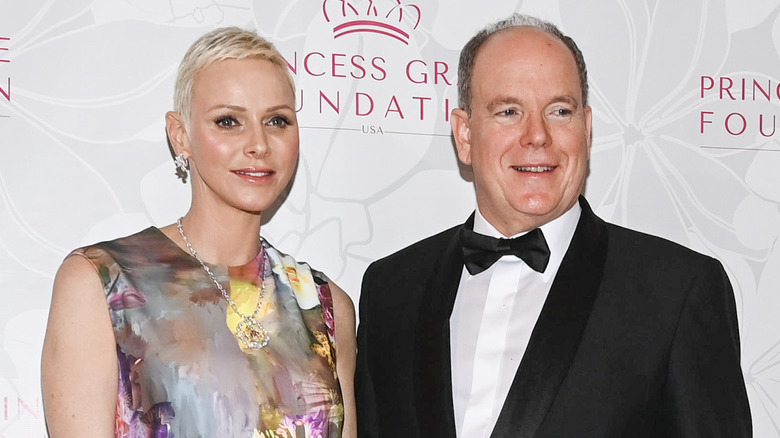 Princess Charlene and Prince Albert posing in evening attire