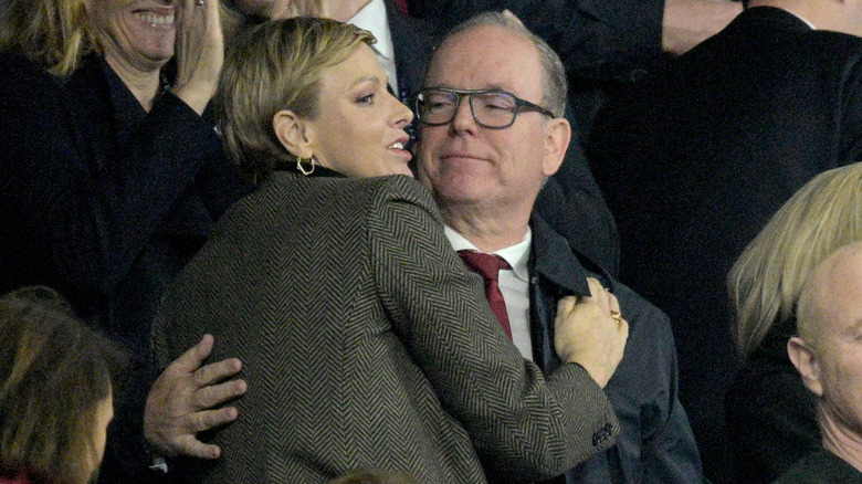 Prince Albert and Princess Charlene embracing