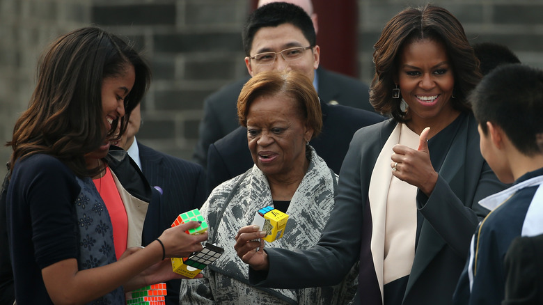 Malia Obama, Marian Robinson, and Michelle Obama visiting the Xian City Wall