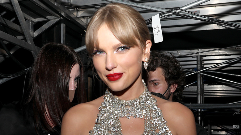 Taylor Swift in a silver dress