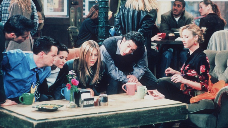 The cast of "Friends" sitting at a table