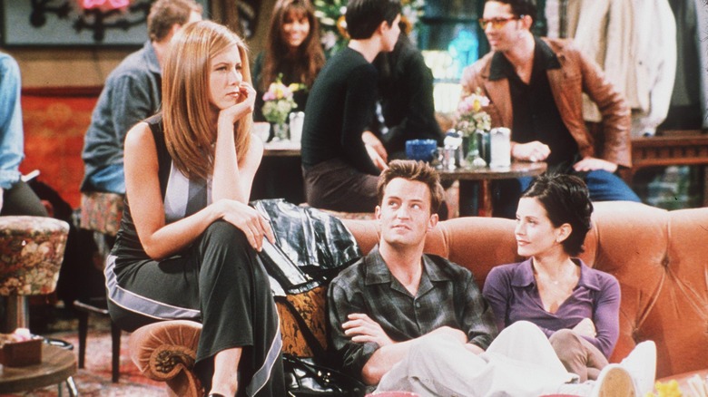 Three "Friends" cast members on a couch