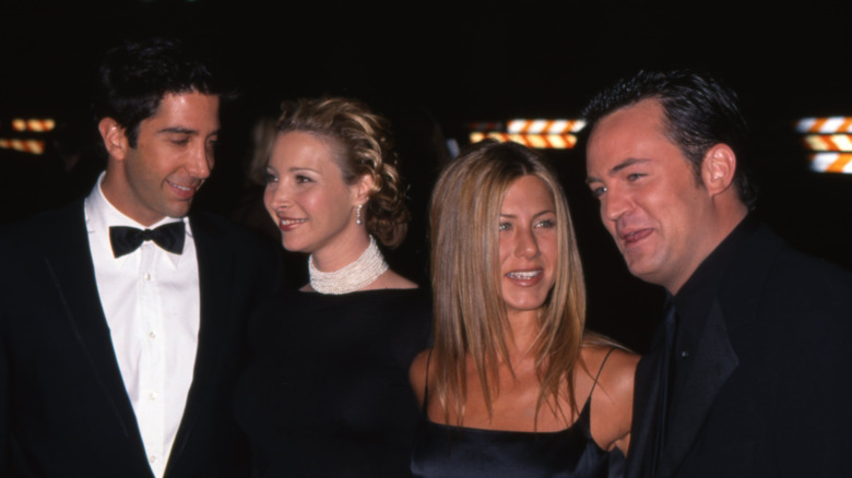 Four members of the "Friends" cast in black tie attire