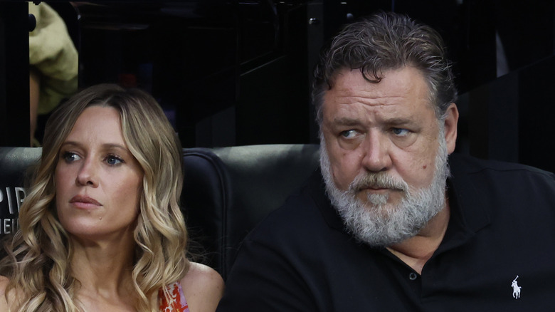 Russell Crowe and Britney Theriot staring at something.