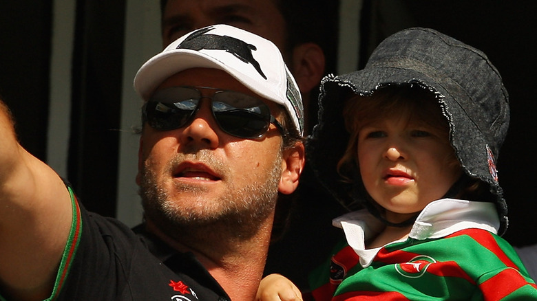 Russell Crowe and Charlie Crowe wearing hats