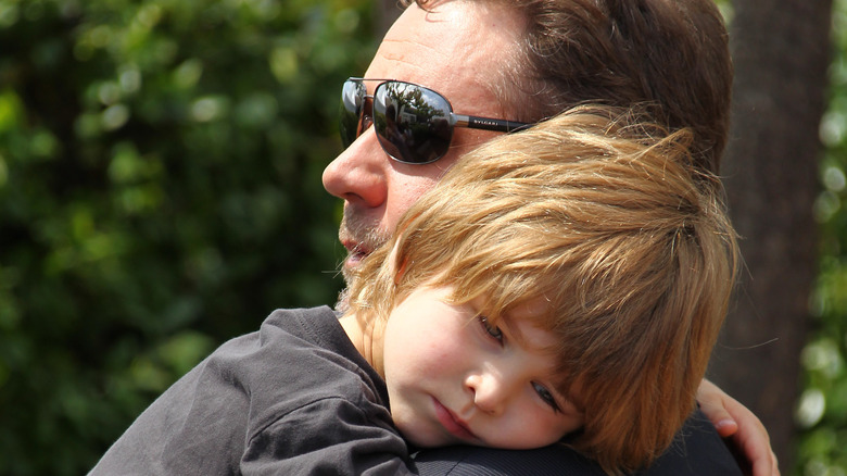 Russell Crowe holding his son