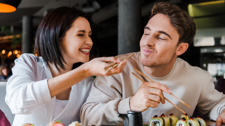 Couple eating sushi