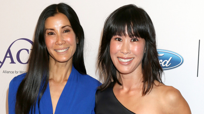 Laura Ling and Lisa Ling posing at an event