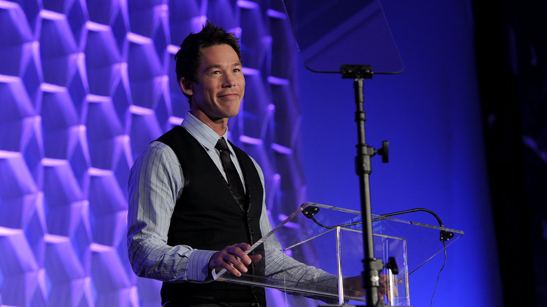 David Bromstad stands at a podium