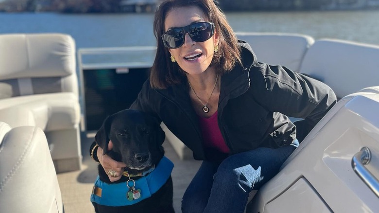 Hilary Farr holding her dog