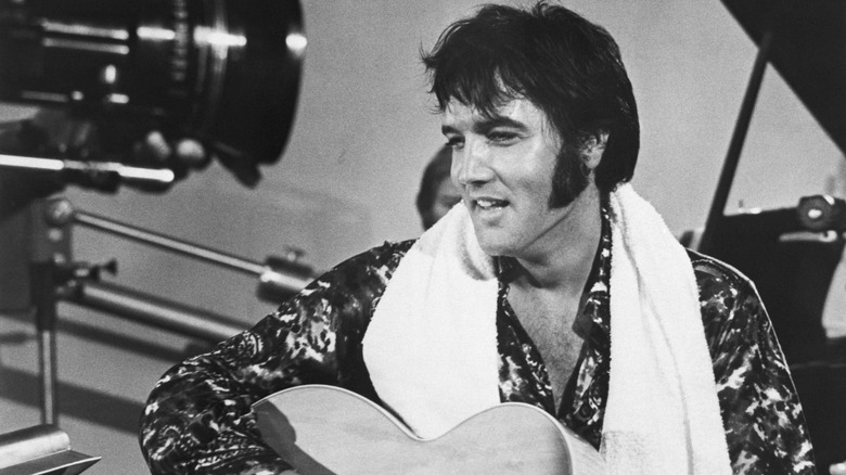 Elvis Presley playing guitar camera