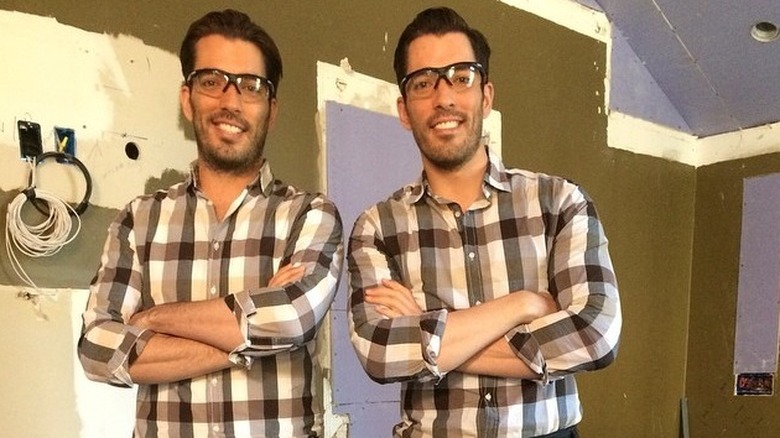 jonathan and drew scott smiling matching outfits